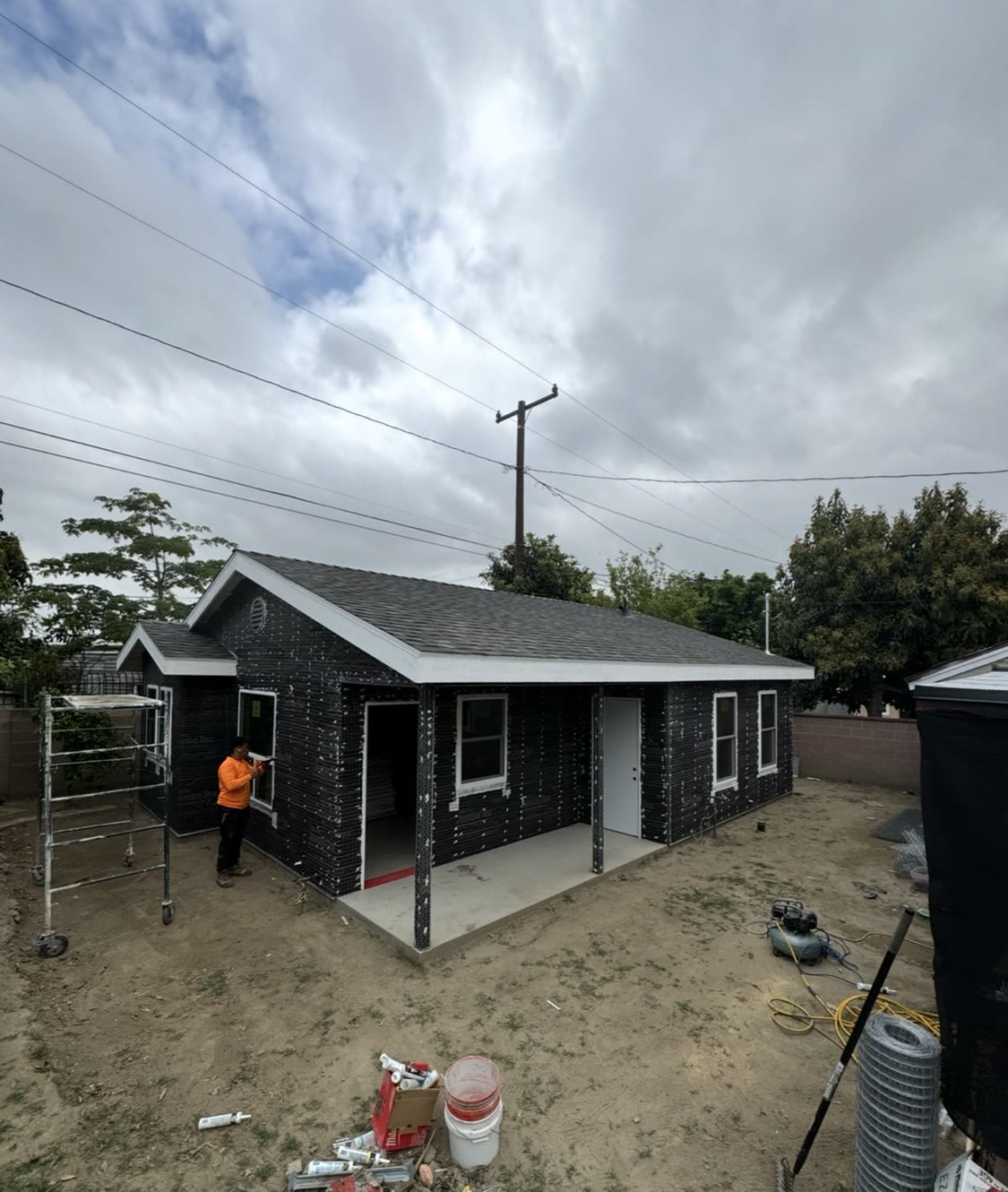 ADU wrapped in black weather barrier before stucco